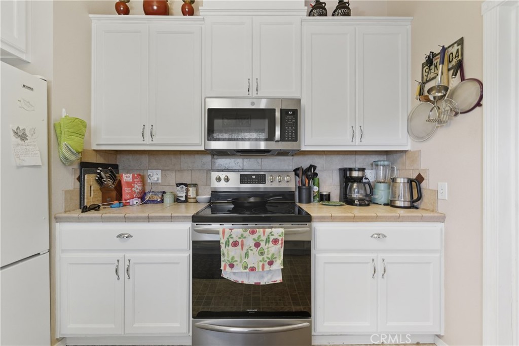 61455 Indian Paint Brush Road Anza, CA 92539 - Photo 9 of 60 a kitchen with stainless steel appliances granite countertop a sink and cabinets