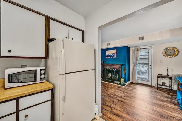 a white refrigerator freezer sitting in a kitchen