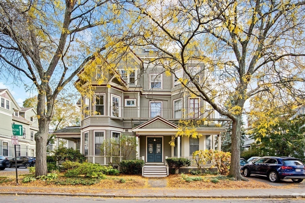 72 Cypress Street, Unit 1 Brookline, MA 02445 - Photo 4 of 23 a front view of a residential apartment building with a yard