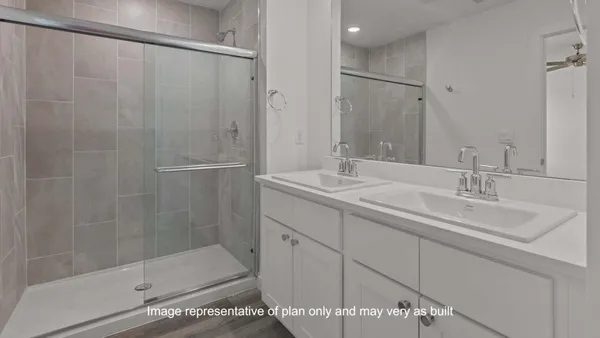 a bathroom with a shower and a sink