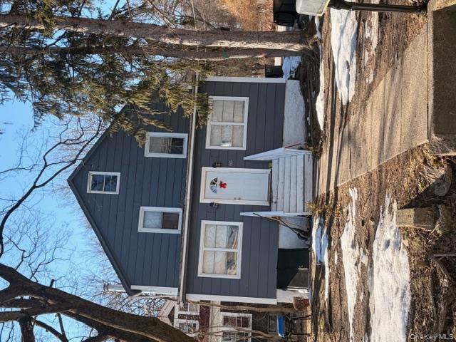 85 Grove Street Newburgh, NY 12550 - Photo 1 of 14 a front view of a house with a road
