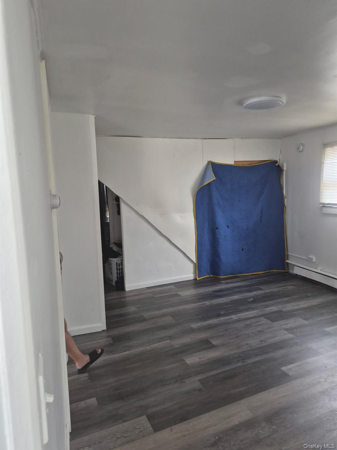 85 Grove Street Newburgh, NY 12550 - Photo 8 of 14 a view of an empty room with wooden floor