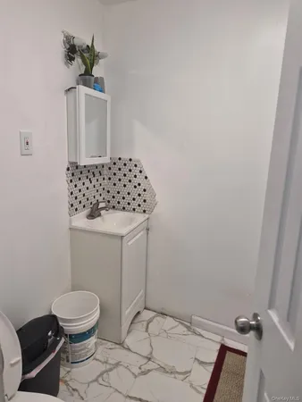 a bathroom with a toilet and a sink