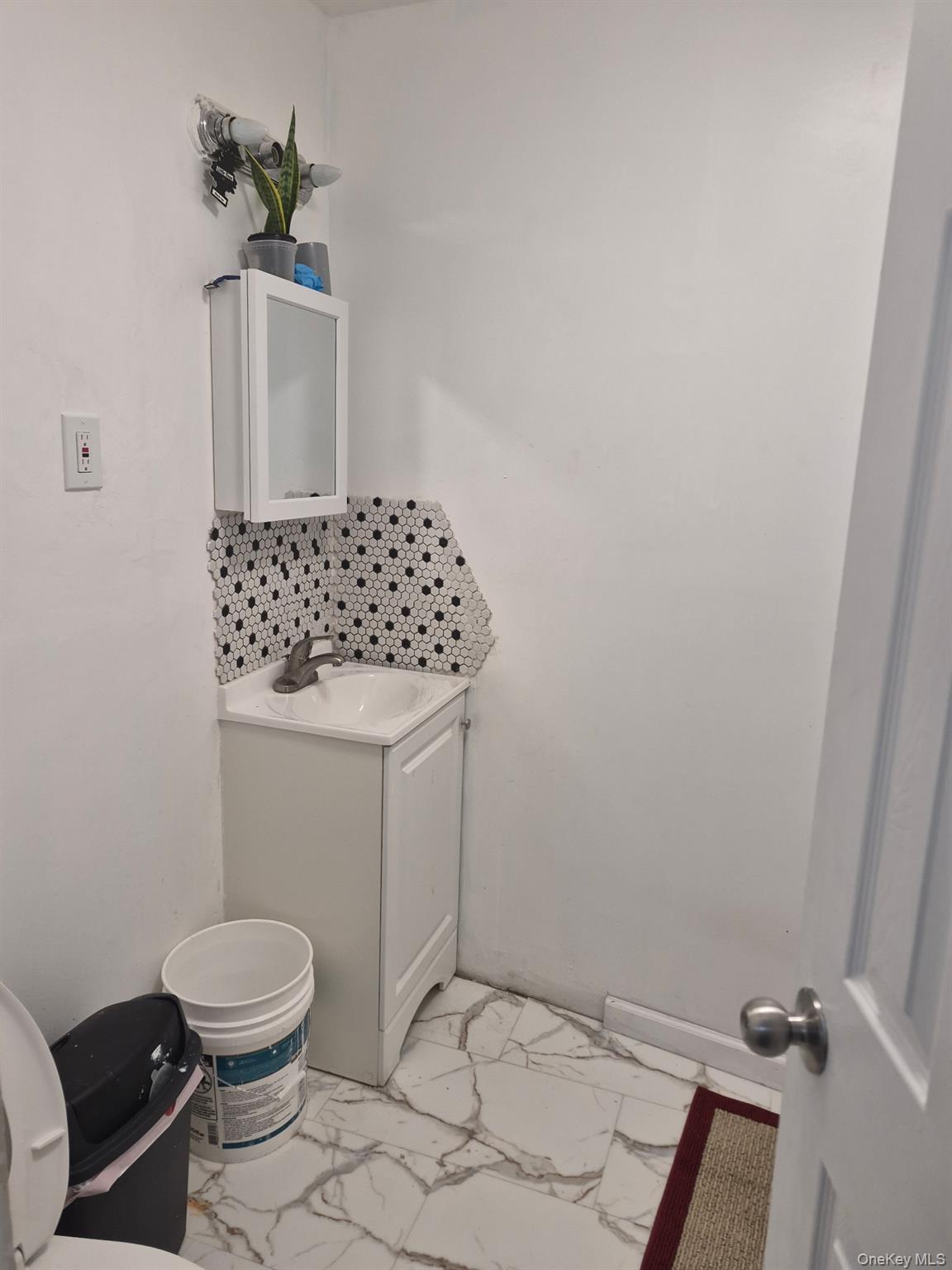 85 Grove Street Newburgh, NY 12550 - Photo 10 of 14 a bathroom with a toilet and a sink