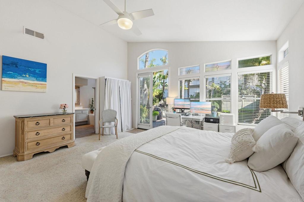 3602 Tulare Court Oceanside, CA 92056 - Photo 16 of 35 a bedroom with a bed and large windows