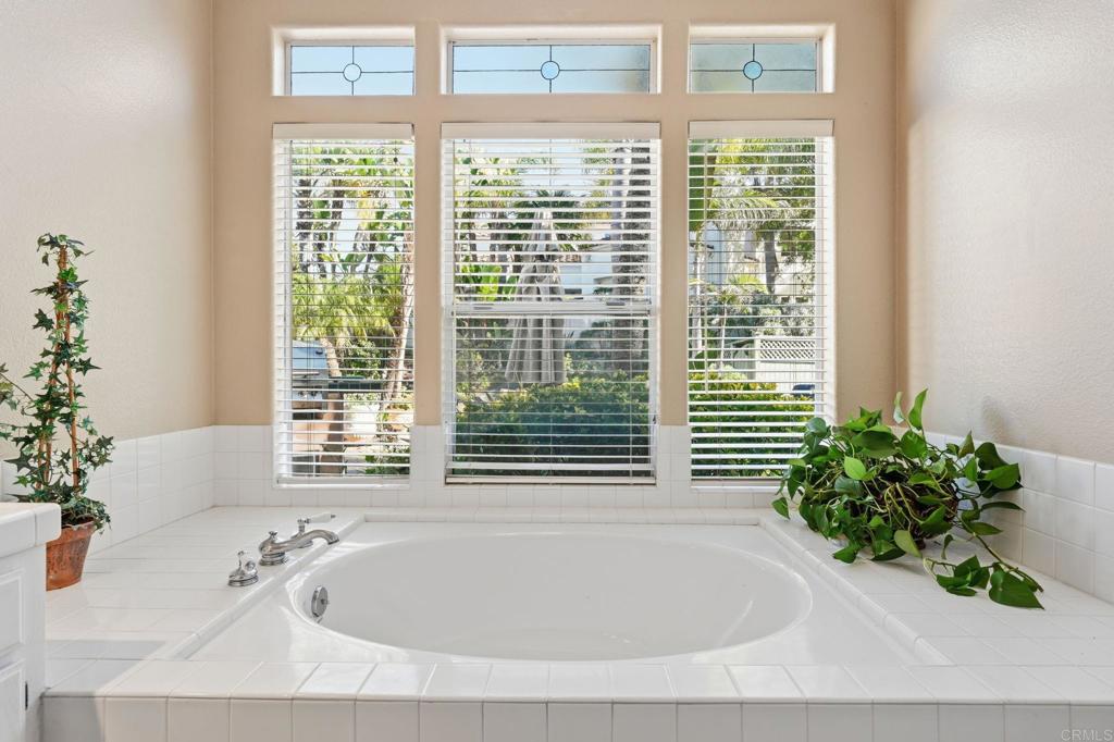 3602 Tulare Court Oceanside, CA 92056 - Photo 19 of 35 a white bath tub sitting in a bathroom next to a window