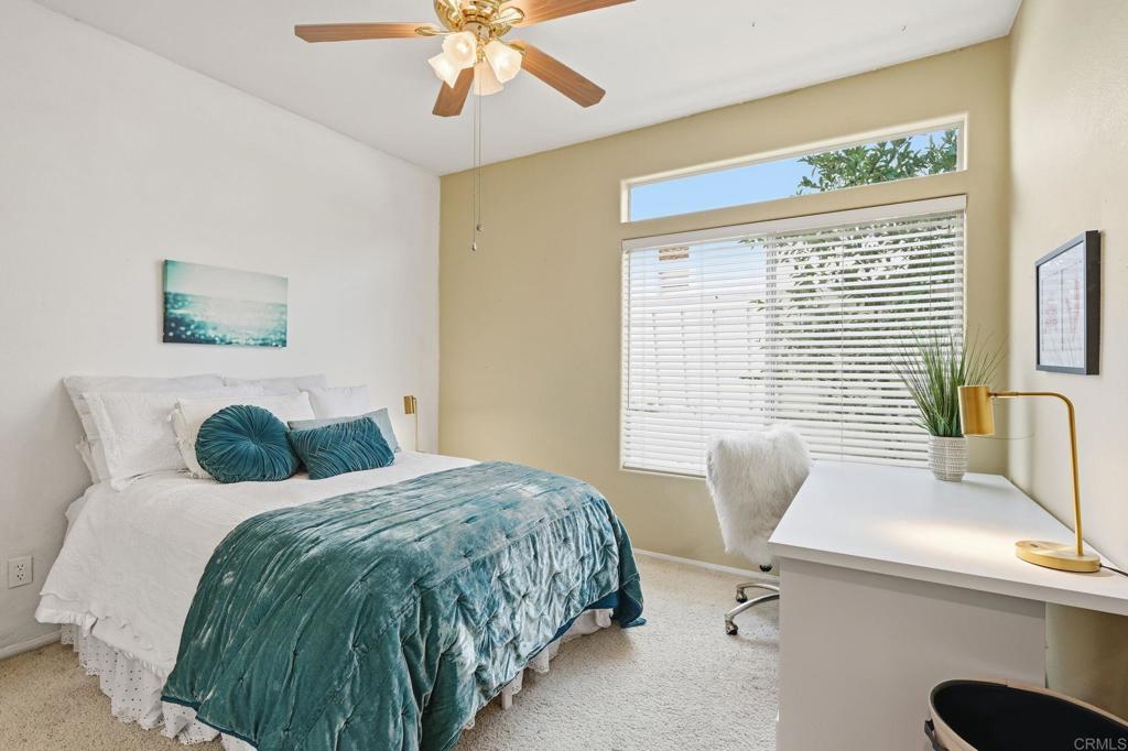 3602 Tulare Court Oceanside, CA 92056 - Photo 21 of 35 a bedroom with a bed and a chandelier