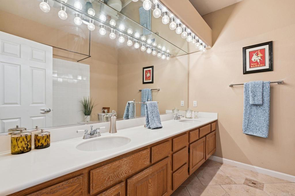 3602 Tulare Court Oceanside, CA 92056 - Photo 26 of 35 a bathroom with a sink double vanity and a mirror