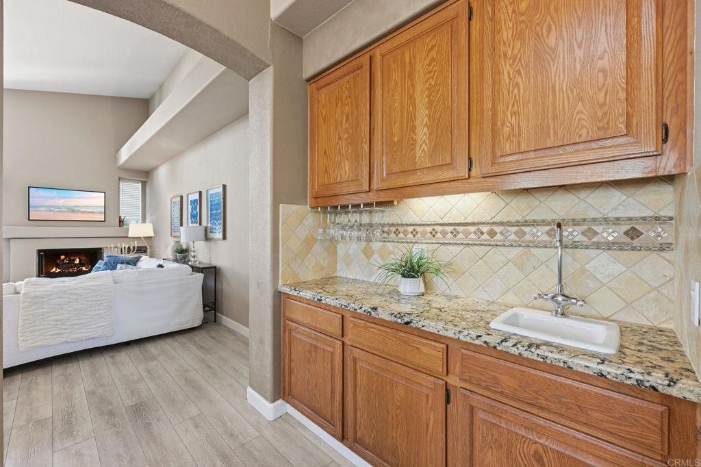 3602 Tulare Court Oceanside, CA 92056 - Photo 7 of 35 a living room with granite countertop furniture and fireplace