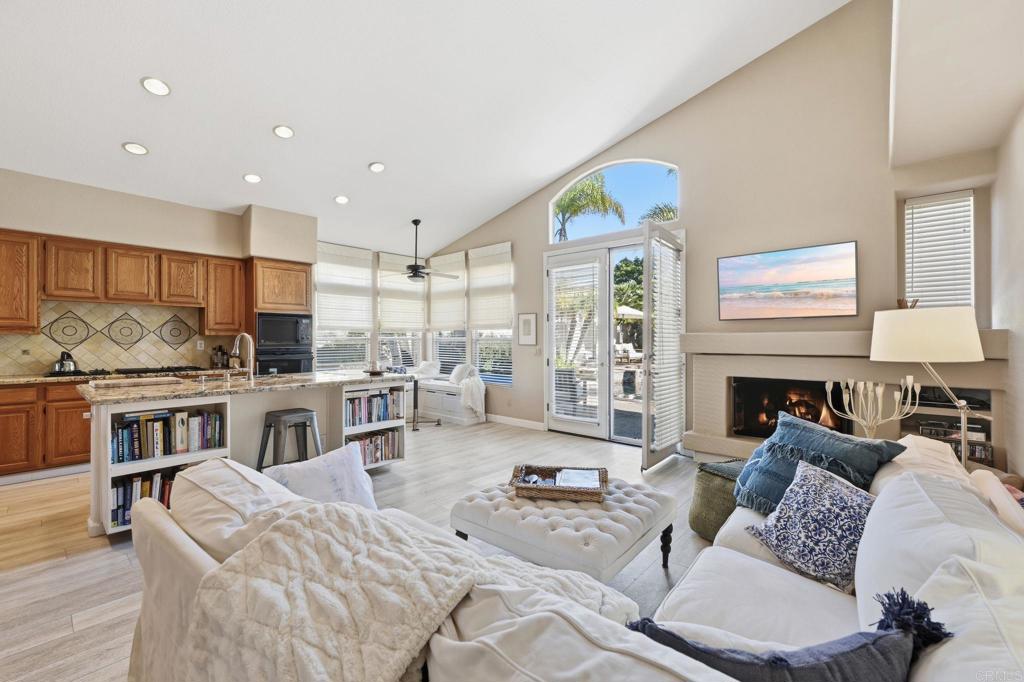 3602 Tulare Court Oceanside, CA 92056 - Photo 8 of 35 a living room with furniture fireplace and kitchen view