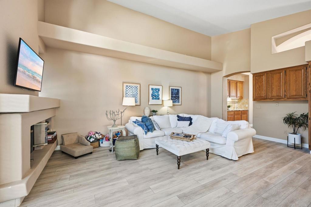 3602 Tulare Court Oceanside, CA 92056 - Photo 10 of 35 a living room with furniture and a fireplace