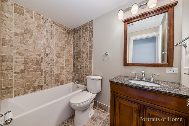 304 Bedford Road Bolingbrook, IL 60440 - Photo 15 of 25 a bathroom with a granite countertop bathtub sink vanity mirror and toilet