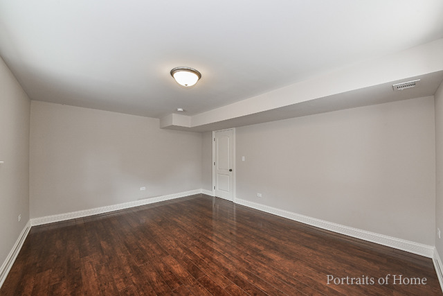 304 Bedford Road Bolingbrook, IL 60440 - Photo 23 of 25 a view of an empty room with wooden floor