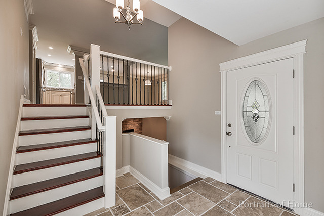 304 Bedford Road Bolingbrook, IL 60440 - Photo 3 of 25 a view of a hallway with windows