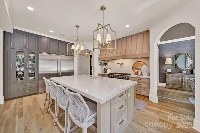 a kitchen with a stove a refrigerator and a stove
