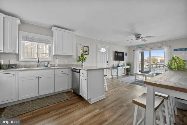 a kitchen with a sink cabinets and window