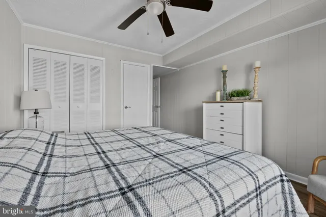 a bedroom with a bed and cabinets