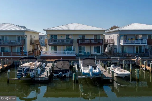 a aerial view of a house with swimming pool and a patio