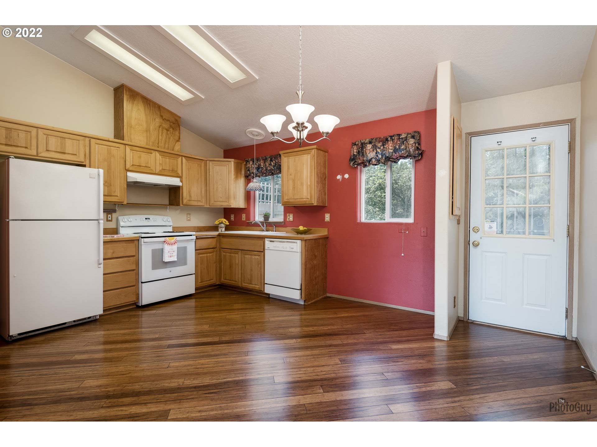 5506 E Street Springfield, OR 97478 - Photo 9 of 26 a kitchen with granite countertop stainless steel appliances and wooden cabinets
