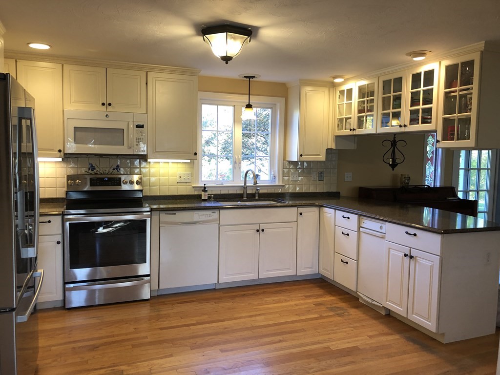 6 Nick Alan Circle Rutland, MA 01543 - Photo 2 of 39 a kitchen with granite countertop a stove and a sink