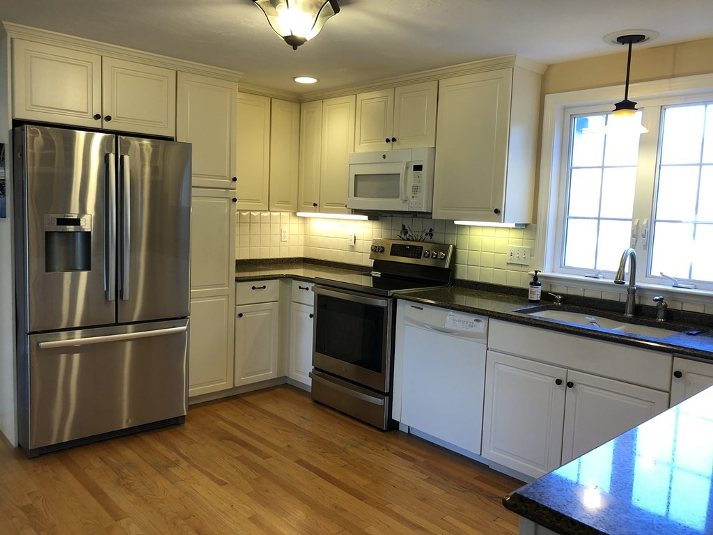 6 Nick Alan Circle Rutland, MA 01543 - Photo 3 of 39 a kitchen with stainless steel appliances a refrigerator sink and cabinets