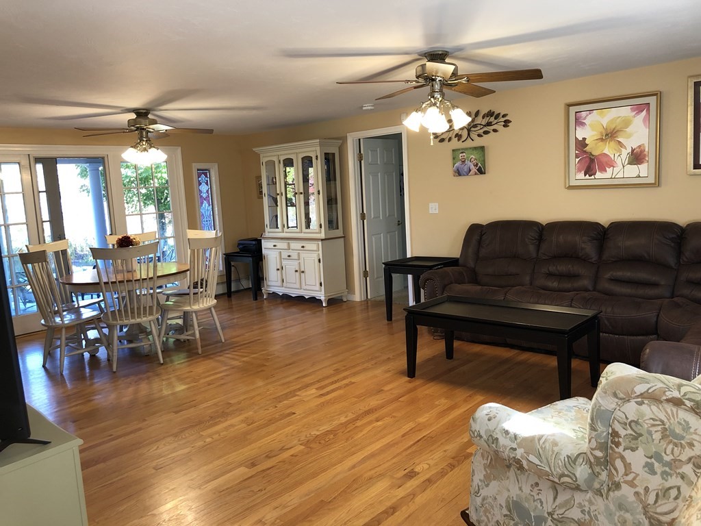 6 Nick Alan Circle Rutland, MA 01543 - Photo 7 of 39 a living room with furniture and a dining table with wooden floor