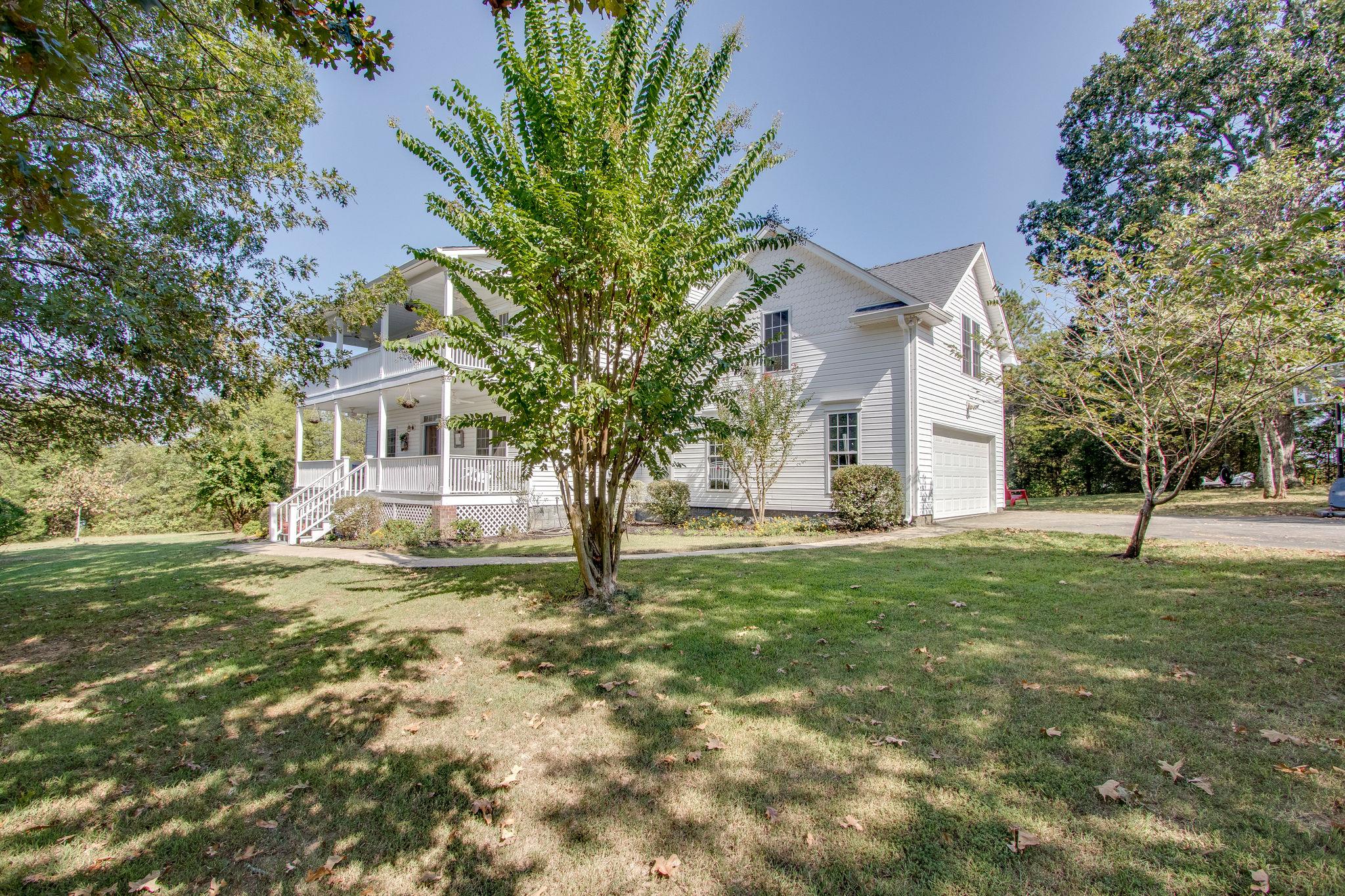 382 Lohman Road Mount Juliet, TN 37122 - Photo 2 of 30 a view of a yard in front of a house with a tree