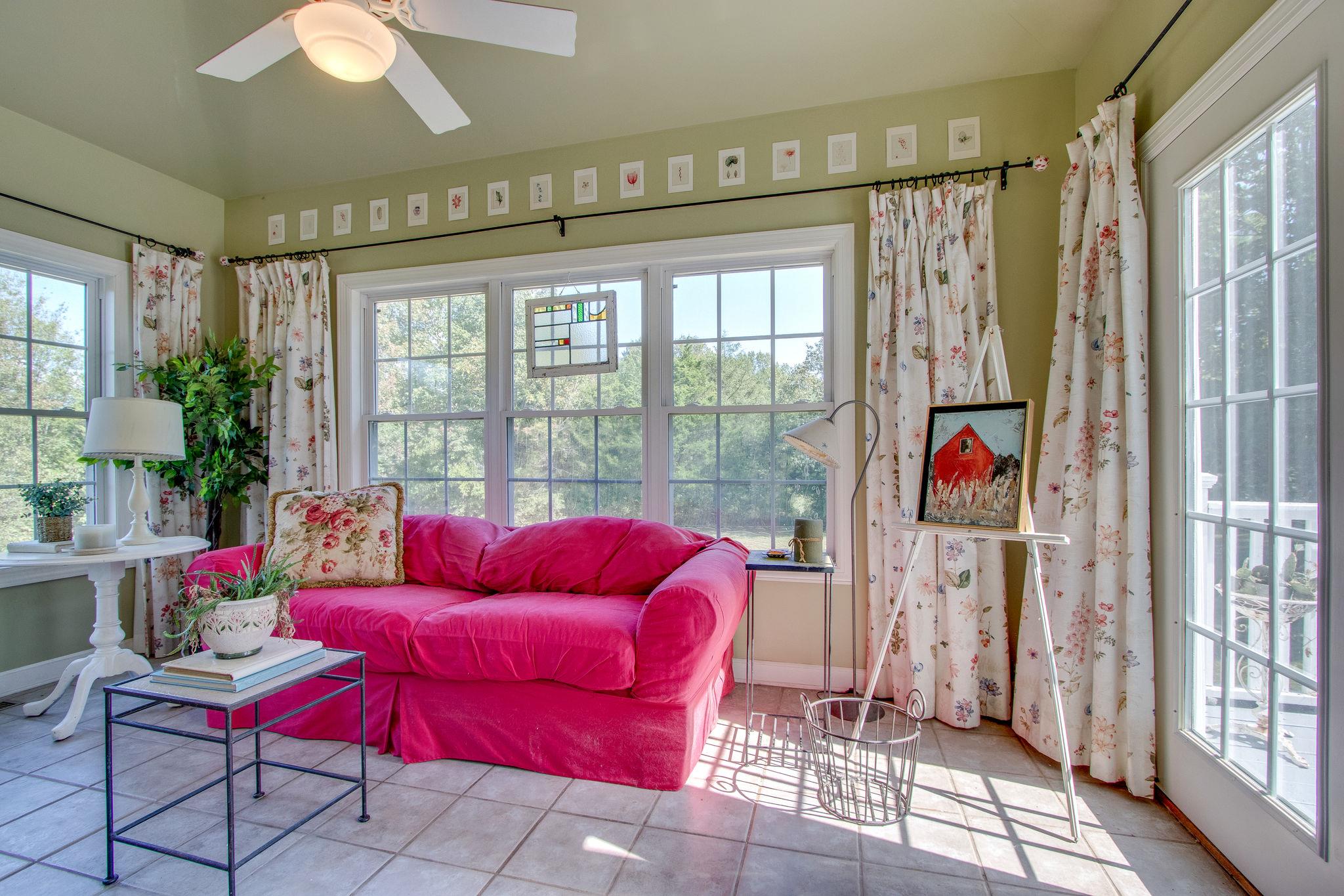 382 Lohman Road Mount Juliet, TN 37122 - Photo 11 of 30 a living room with furniture and a floor to ceiling window