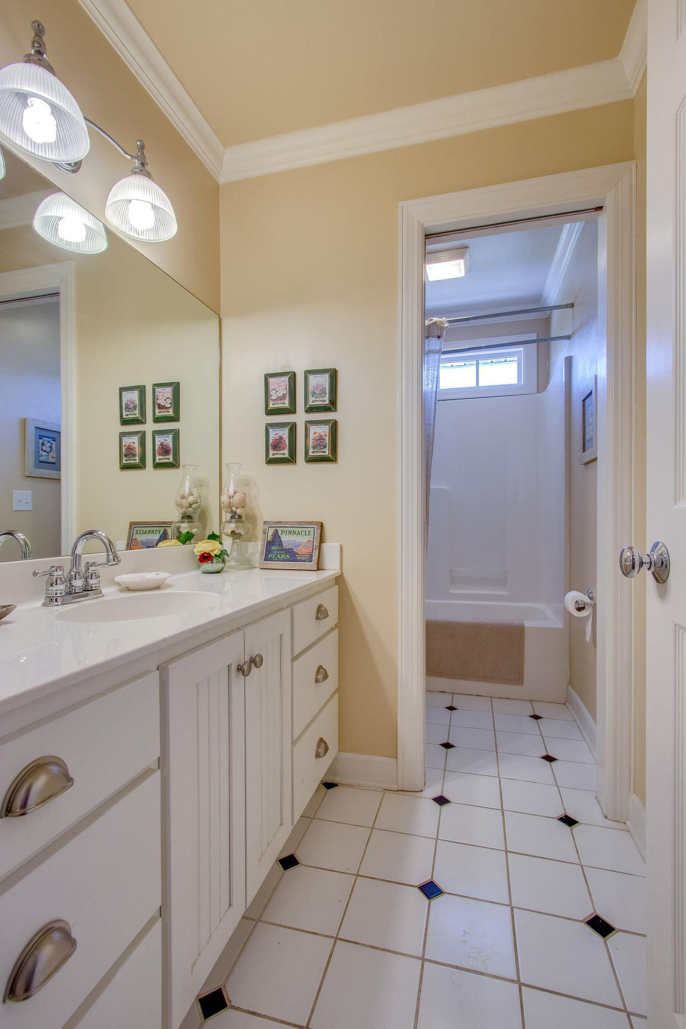 382 Lohman Road Mount Juliet, TN 37122 - Photo 21 of 30 a spacious bathroom with a granite countertop sink mirror and shower