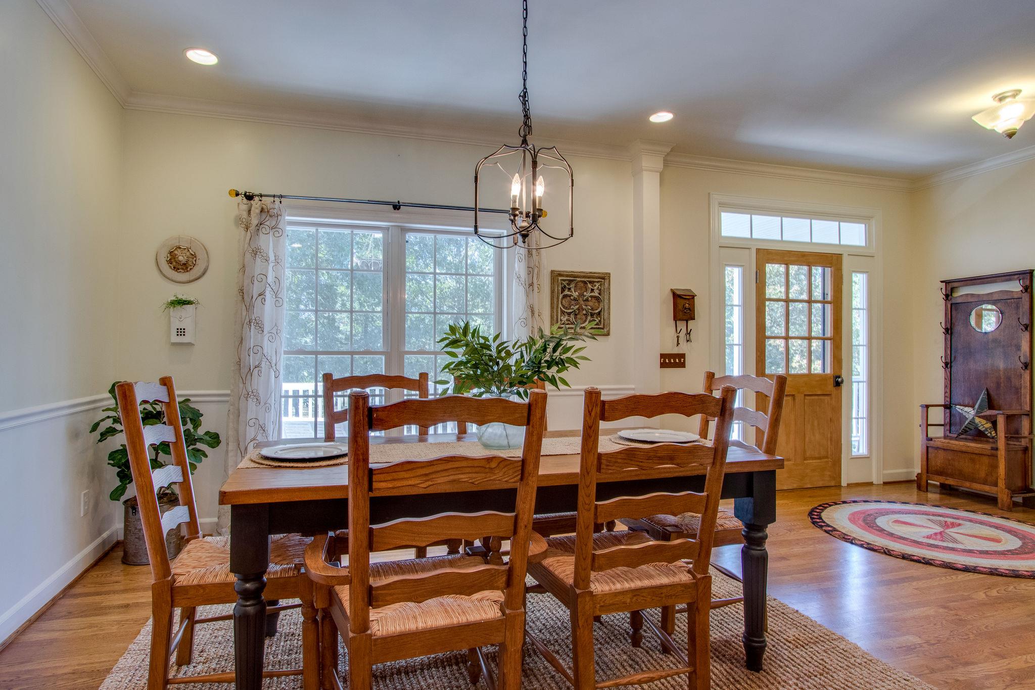 382 Lohman Road Mount Juliet, TN 37122 - Photo 6 of 30 a dining room with furniture a chandelier and wooden floor