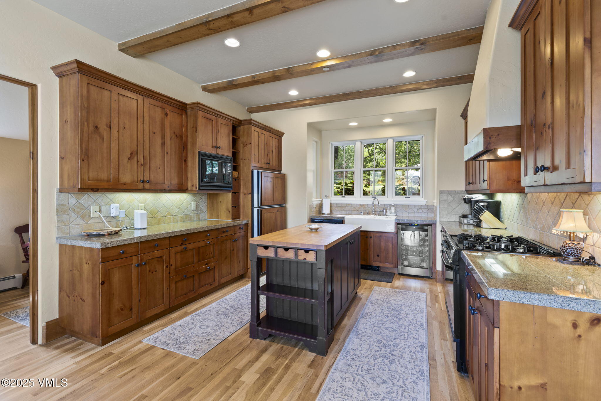 94 Eagles Glen Road Edwards, CO 81632 - Photo 12 of 43 a kitchen with kitchen island granite countertop lots of counter top space and stainless steel appliances
