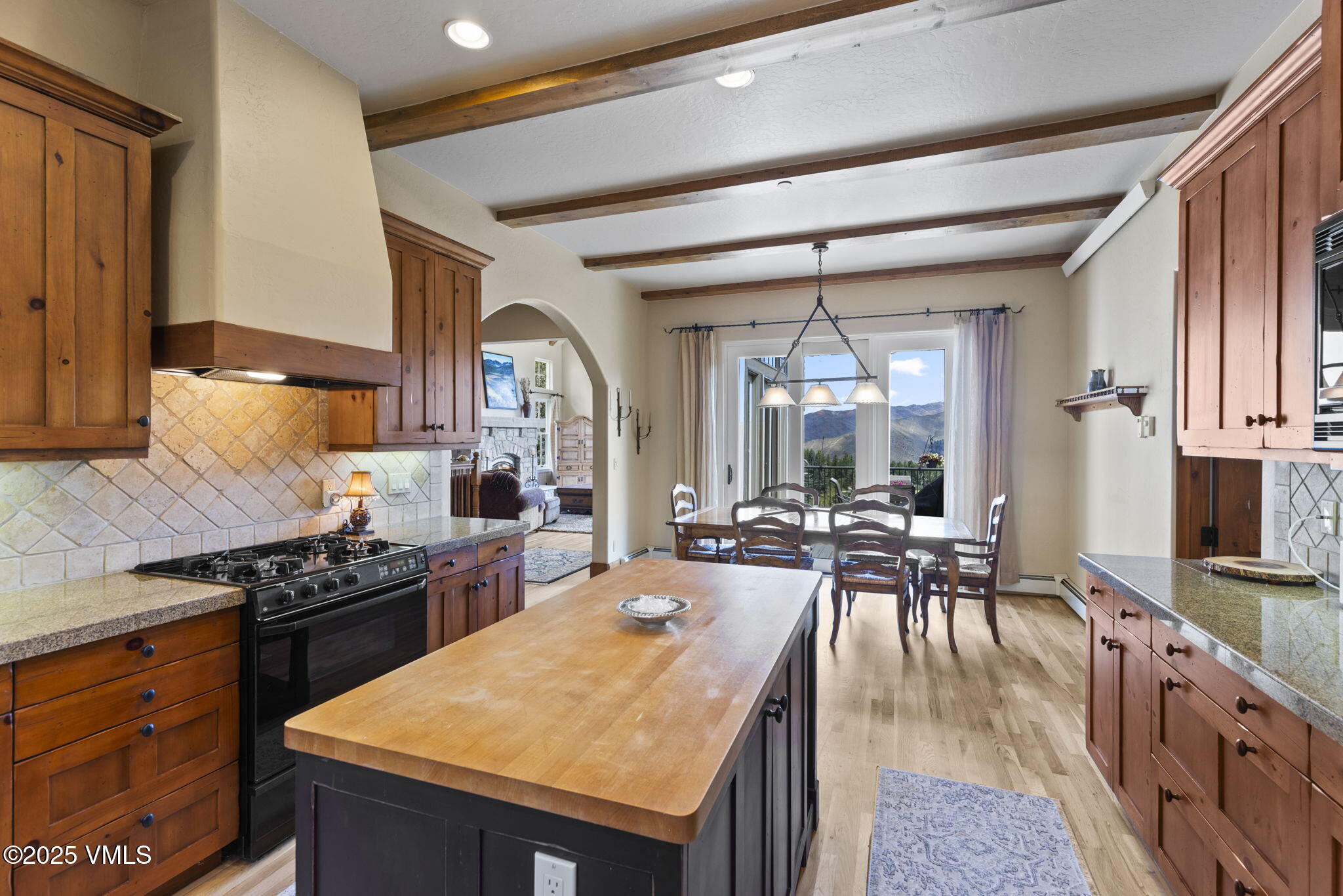 94 Eagles Glen Road Edwards, CO 81632 - Photo 14 of 43 a kitchen with a table chairs stove and cabinets