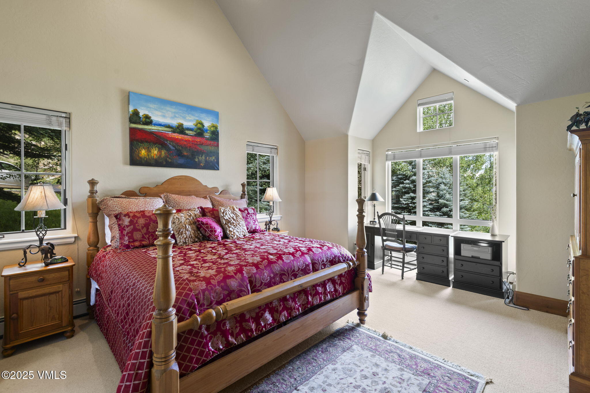 94 Eagles Glen Road Edwards, CO 81632 - Photo 19 of 43 a bedroom with a bed and a table in it