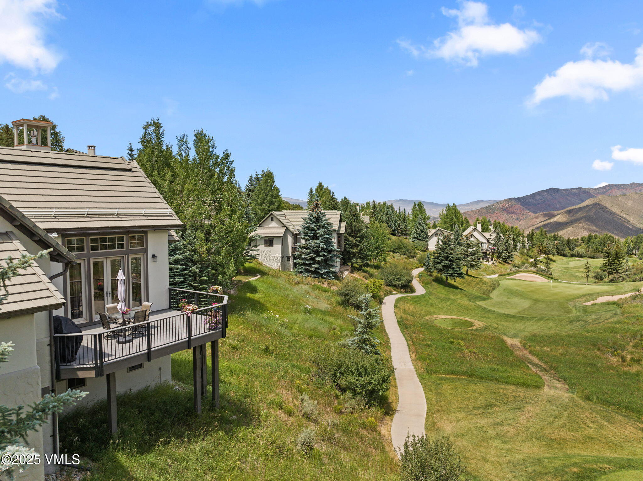 94 Eagles Glen Road Edwards, CO 81632 - Photo 2 of 43 a balcony with table and chairs