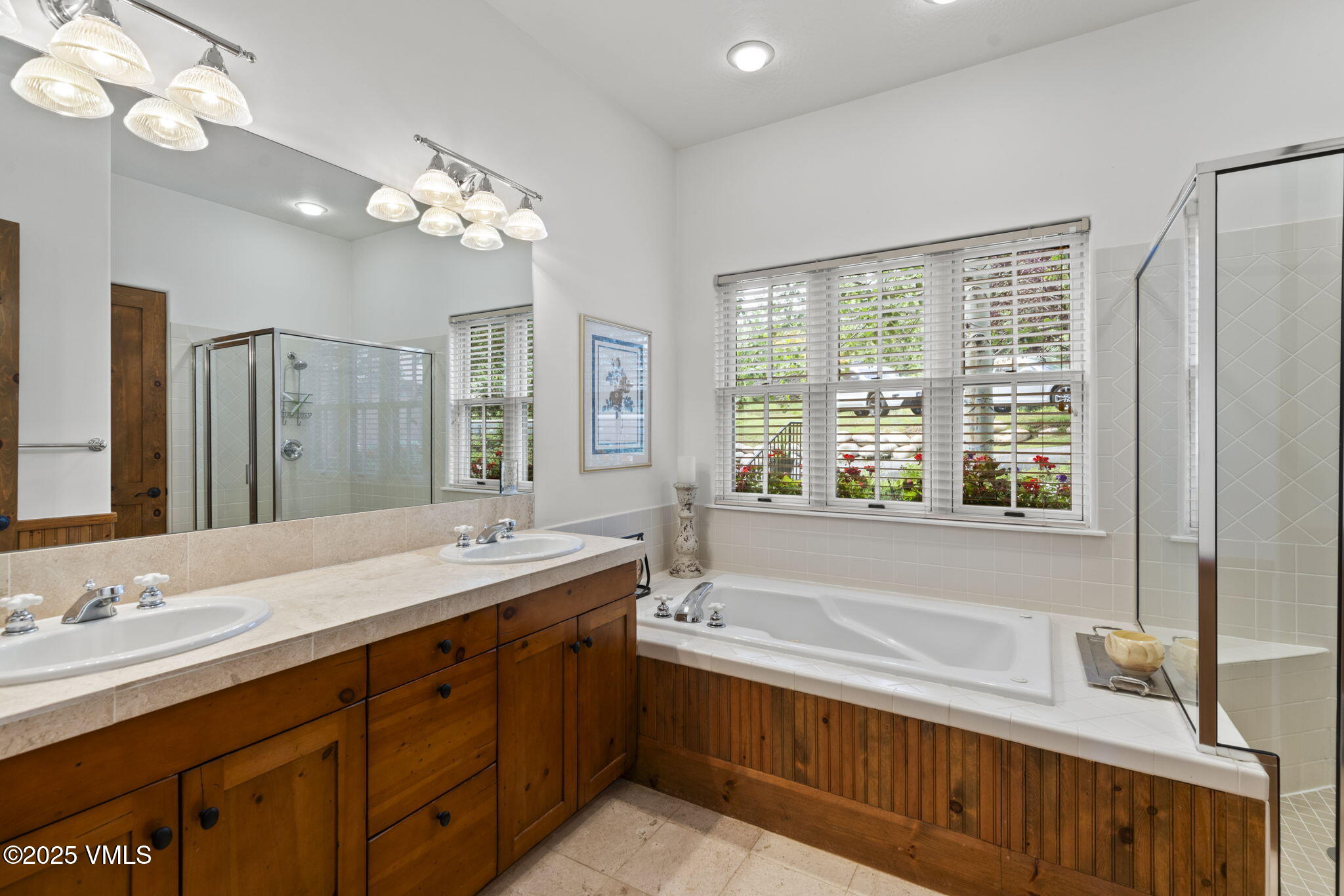 94 Eagles Glen Road Edwards, CO 81632 - Photo 22 of 43 a bathroom with a tub a sink double vanity and a mirror
