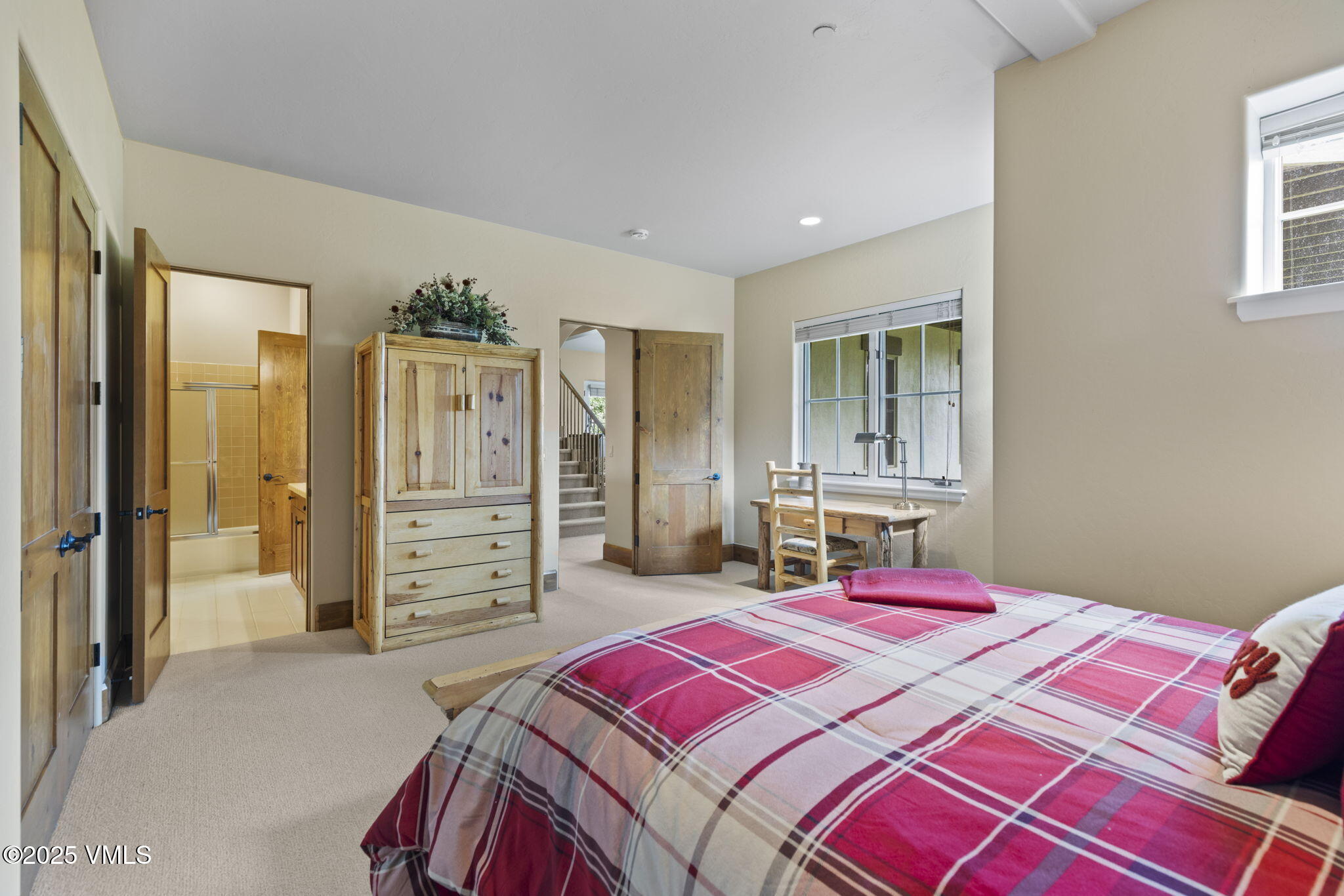 94 Eagles Glen Road Edwards, CO 81632 - Photo 34 of 43 a bedroom with a bed closet and mirror