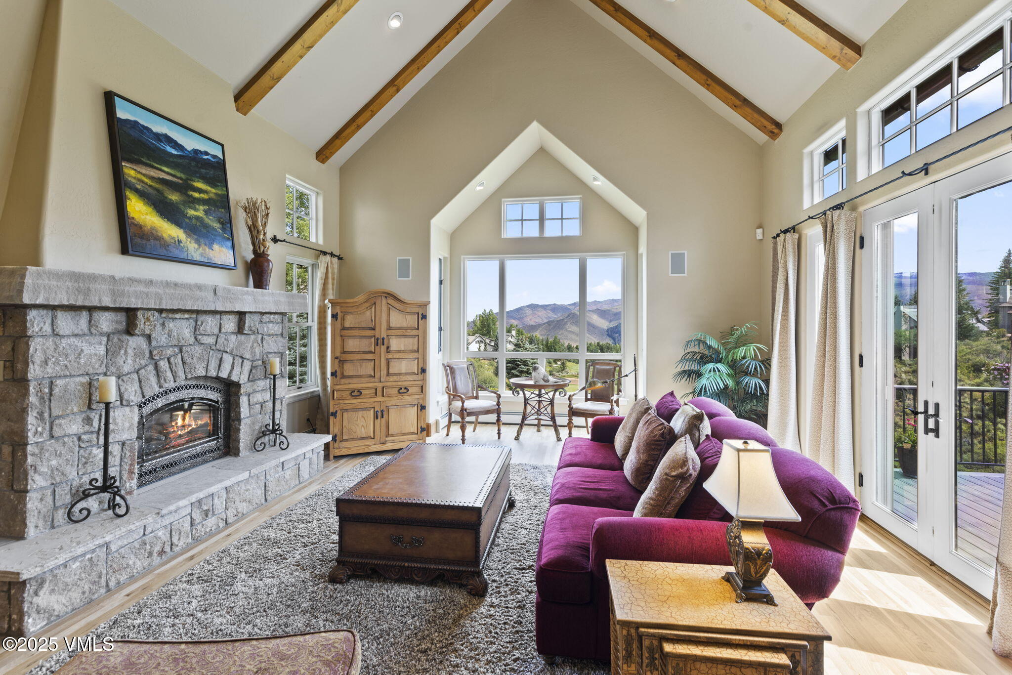 94 Eagles Glen Road Edwards, CO 81632 - Photo 4 of 43 a living room with furniture a fireplace and a floor to ceiling window