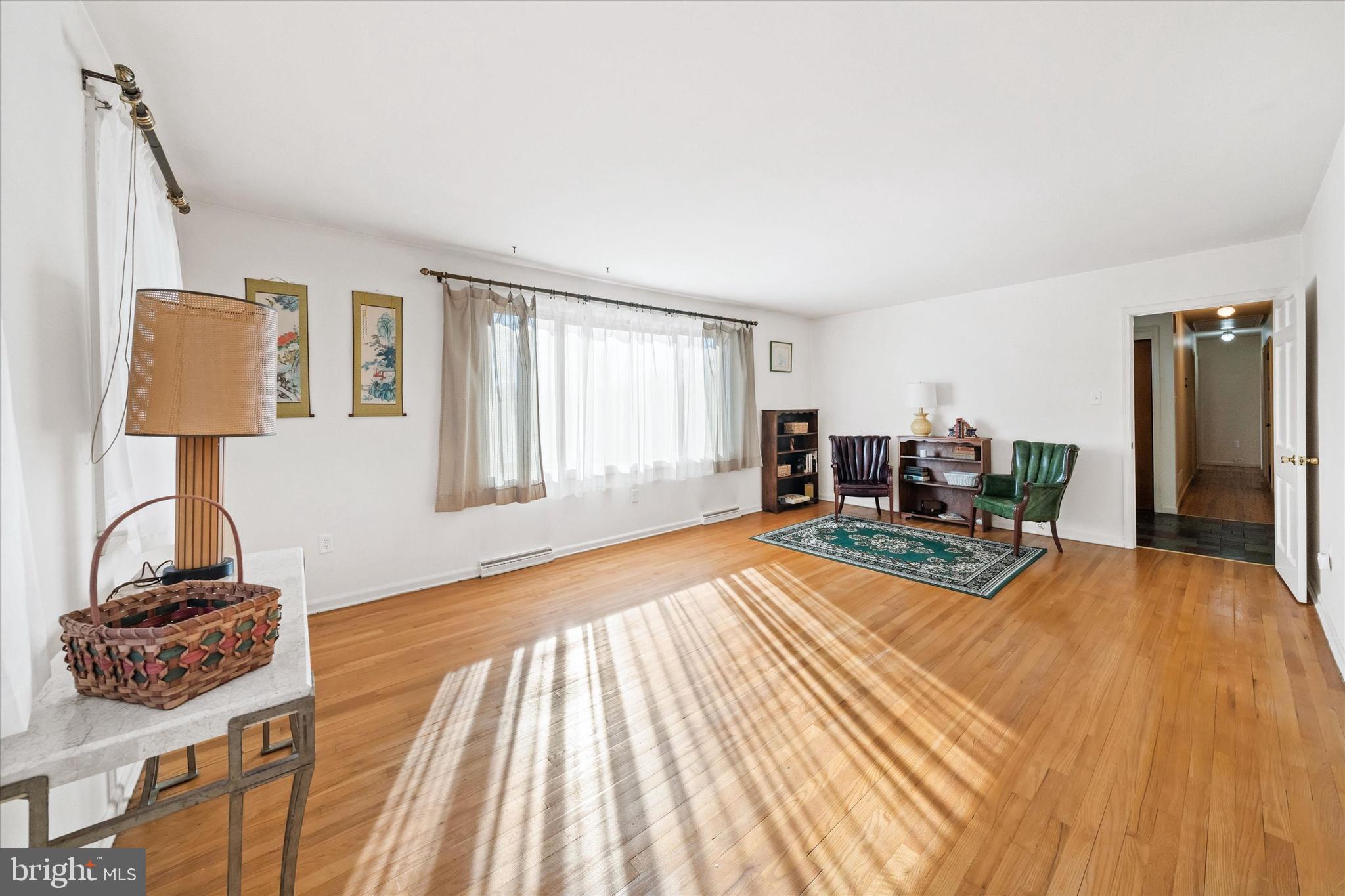 213 Valley Lane Hockessin, DE 19707 - Photo 14 of 27 a living room with furniture and a wooden floor