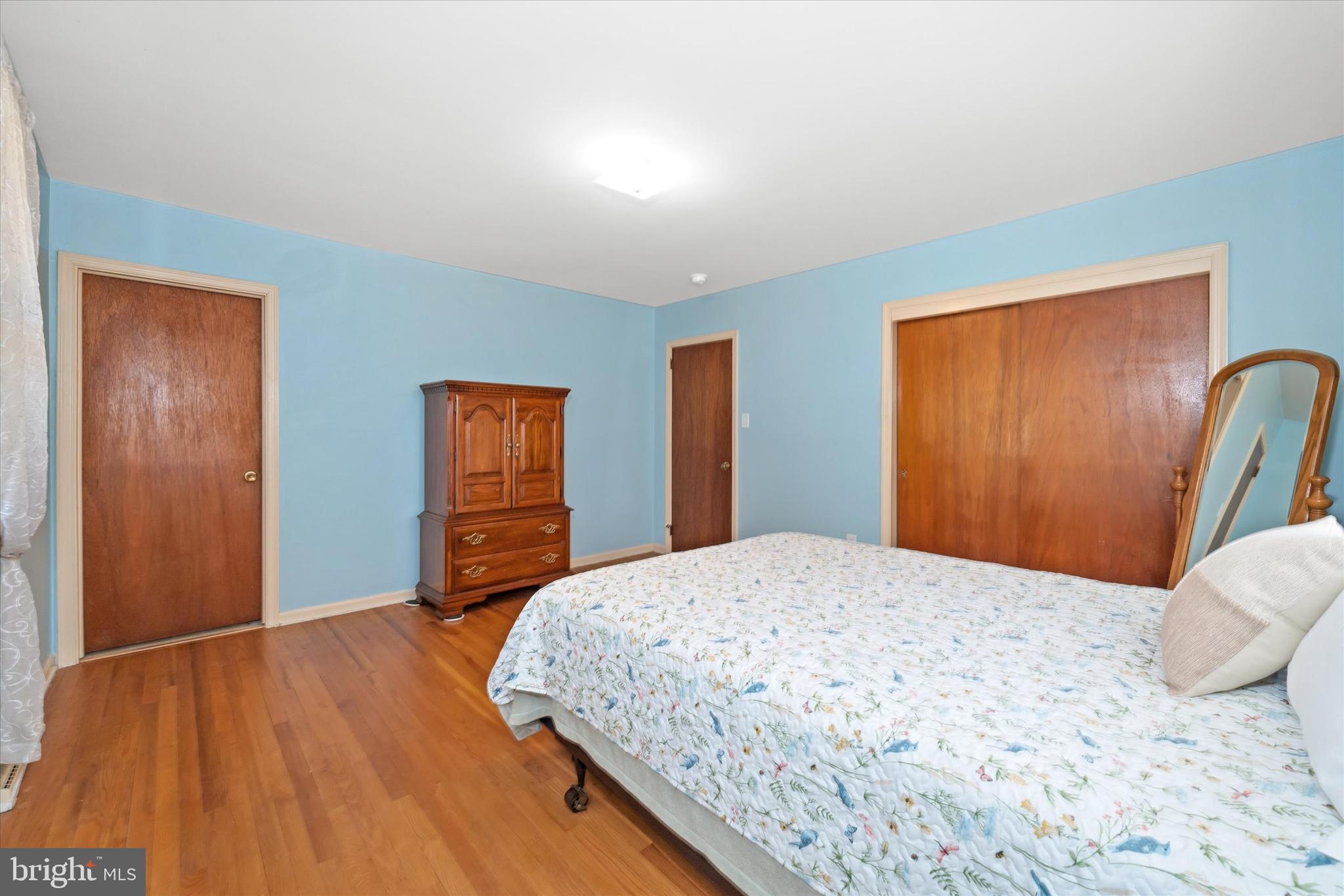 213 Valley Lane Hockessin, DE 19707 - Photo 16 of 27 a bedroom with a bed and wooden floor