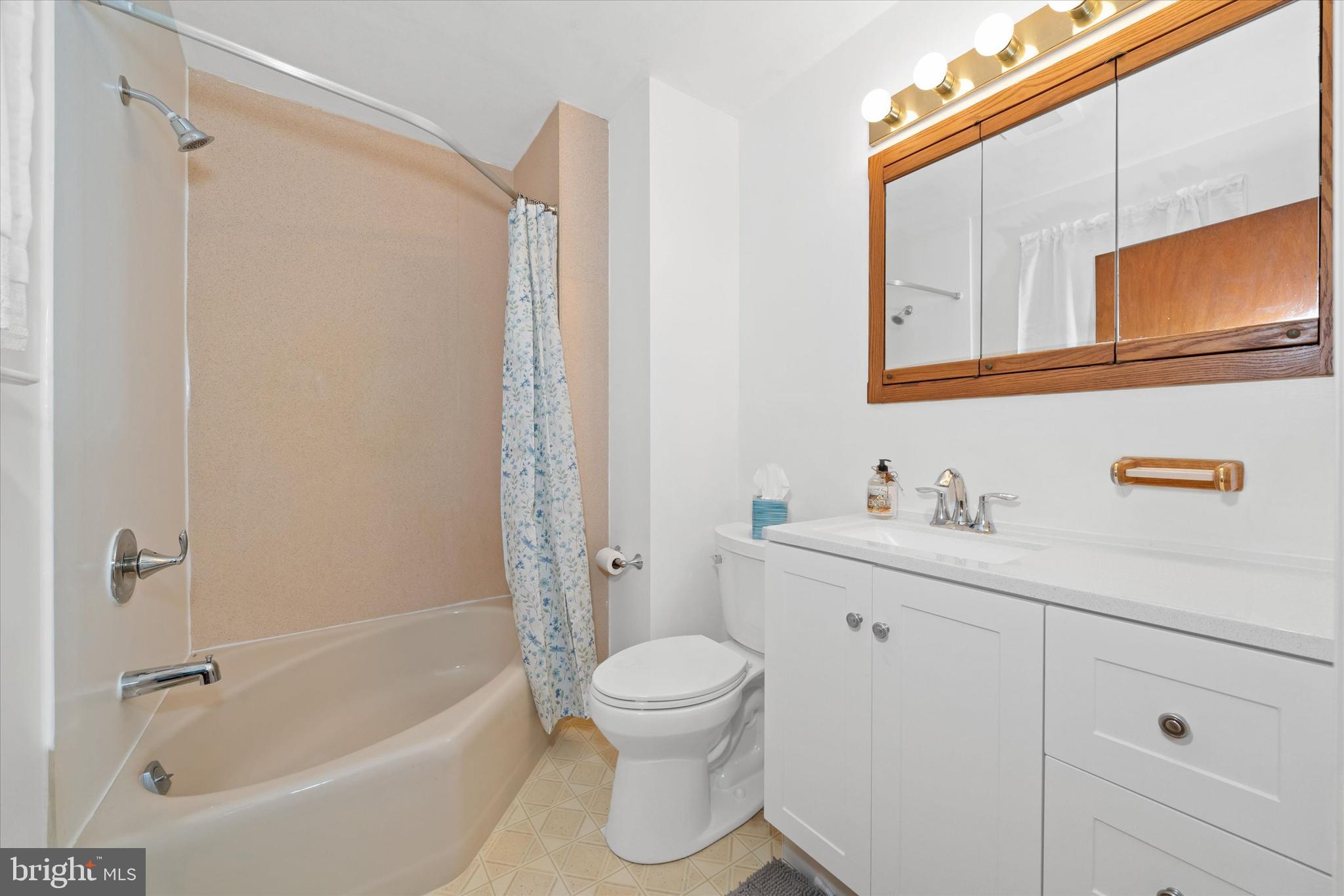 213 Valley Lane Hockessin, DE 19707 - Photo 17 of 27 a bathroom with a granite countertop sink toilet and shower