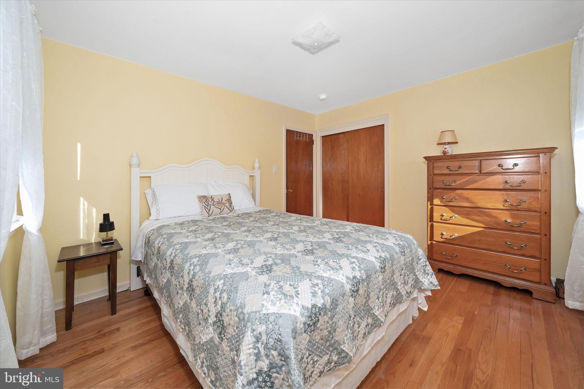 213 Valley Lane Hockessin, DE 19707 - Photo 19 of 27 a spacious bedroom with a bed and furniture