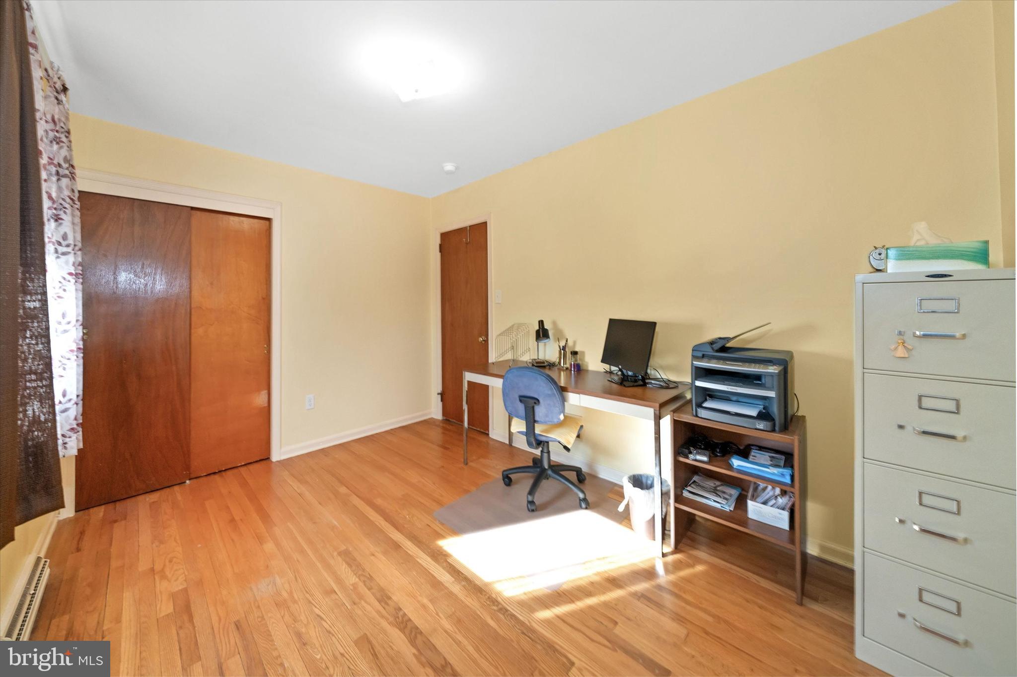 213 Valley Lane Hockessin, DE 19707 - Photo 21 of 27 a bed room with a bed and a television