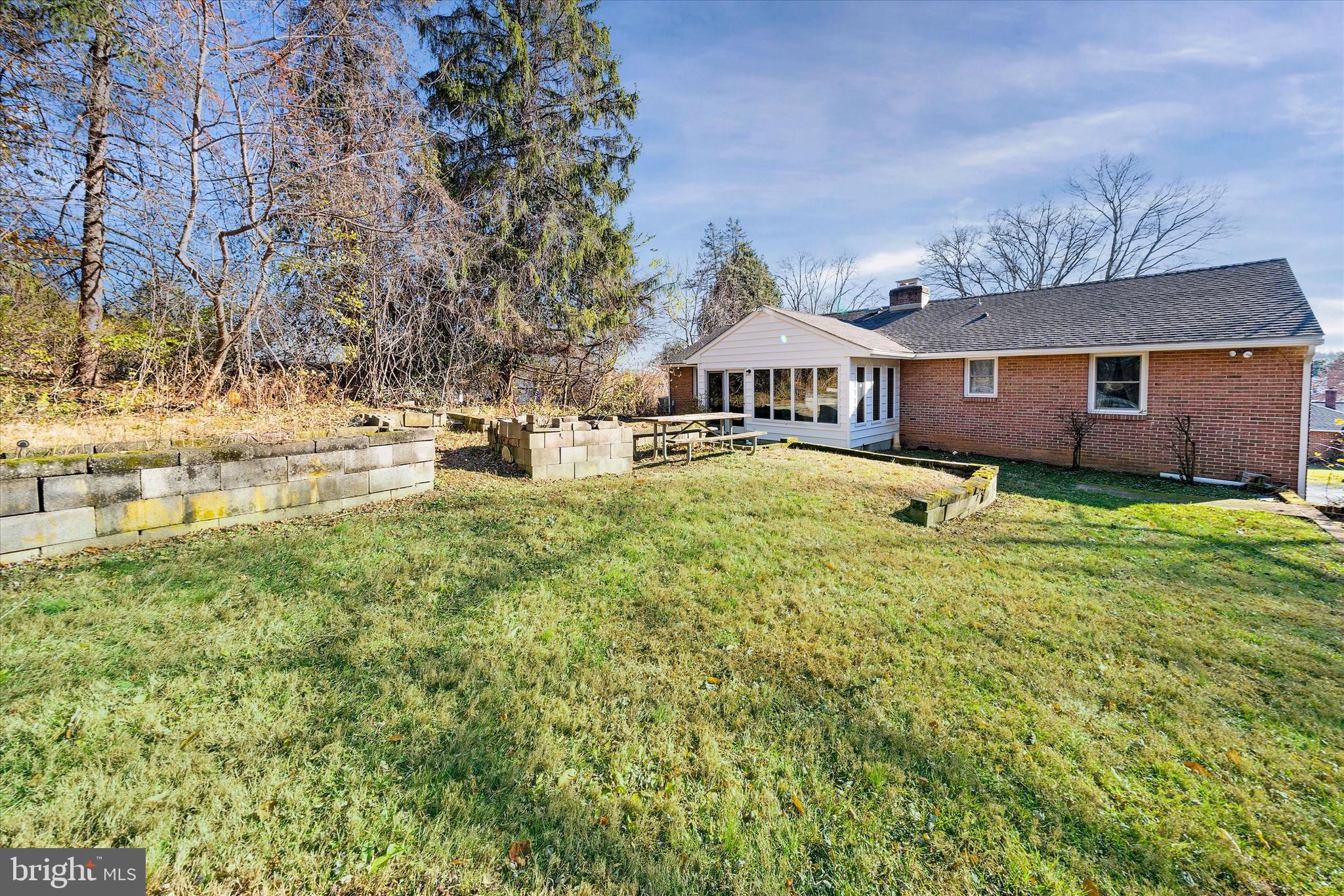 213 Valley Lane Hockessin, DE 19707 - Photo 23 of 27 a front view of a house with a yard