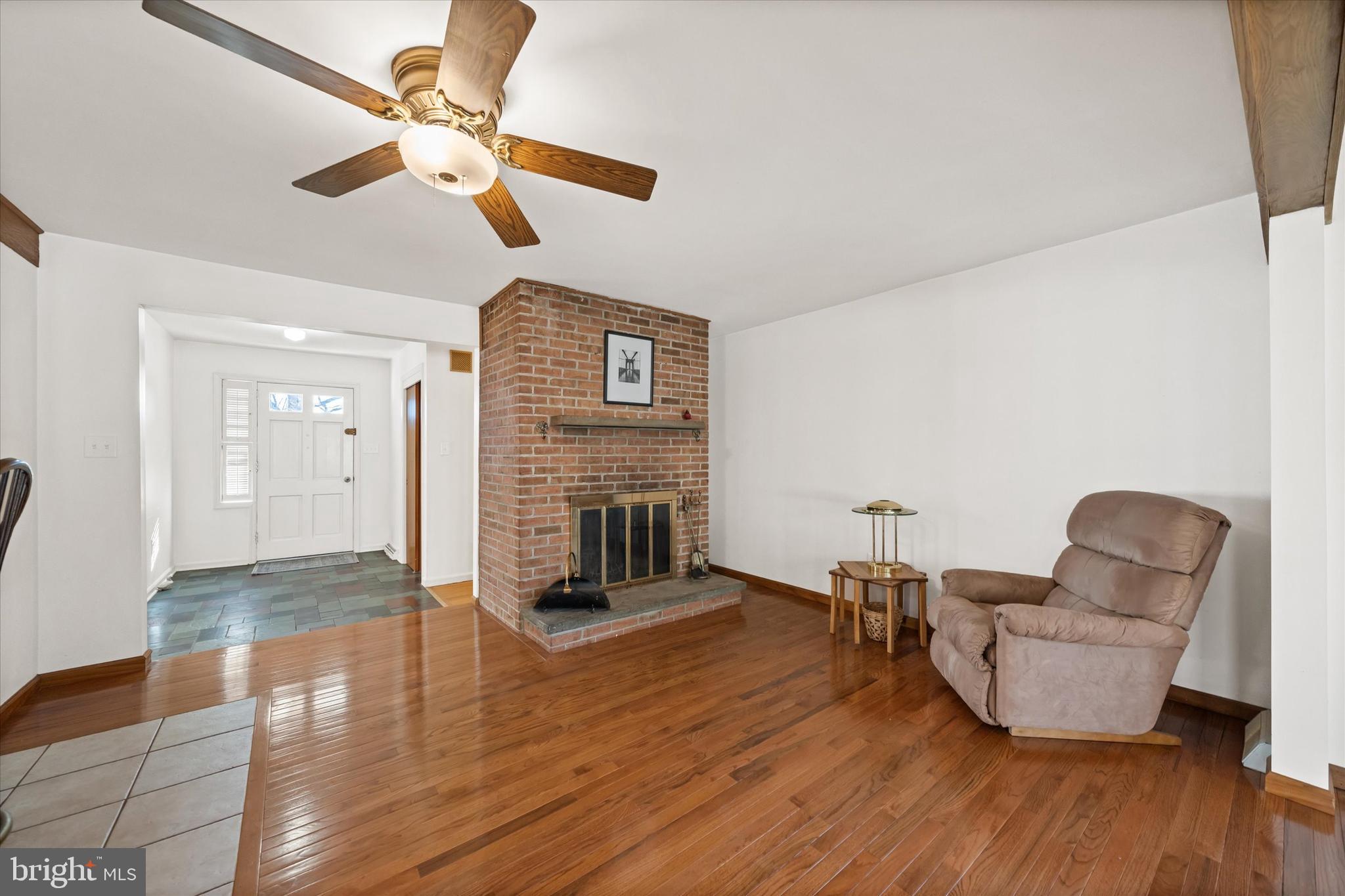 213 Valley Lane Hockessin, DE 19707 - Photo 3 of 27 a living room with furniture and a fireplace