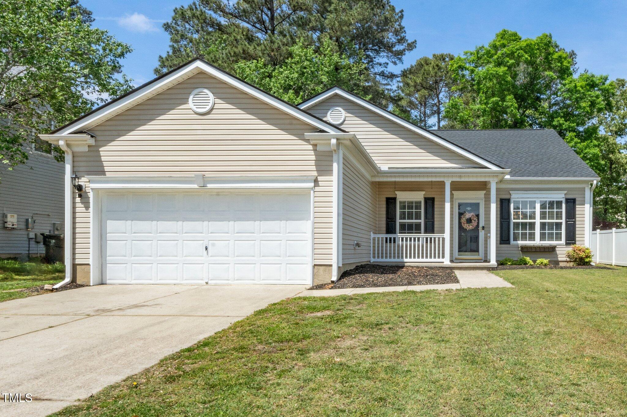 8300 Neuse Hunter Drive Raleigh, NC 27616 - Photo 1 of 32 front view of a house with a yard