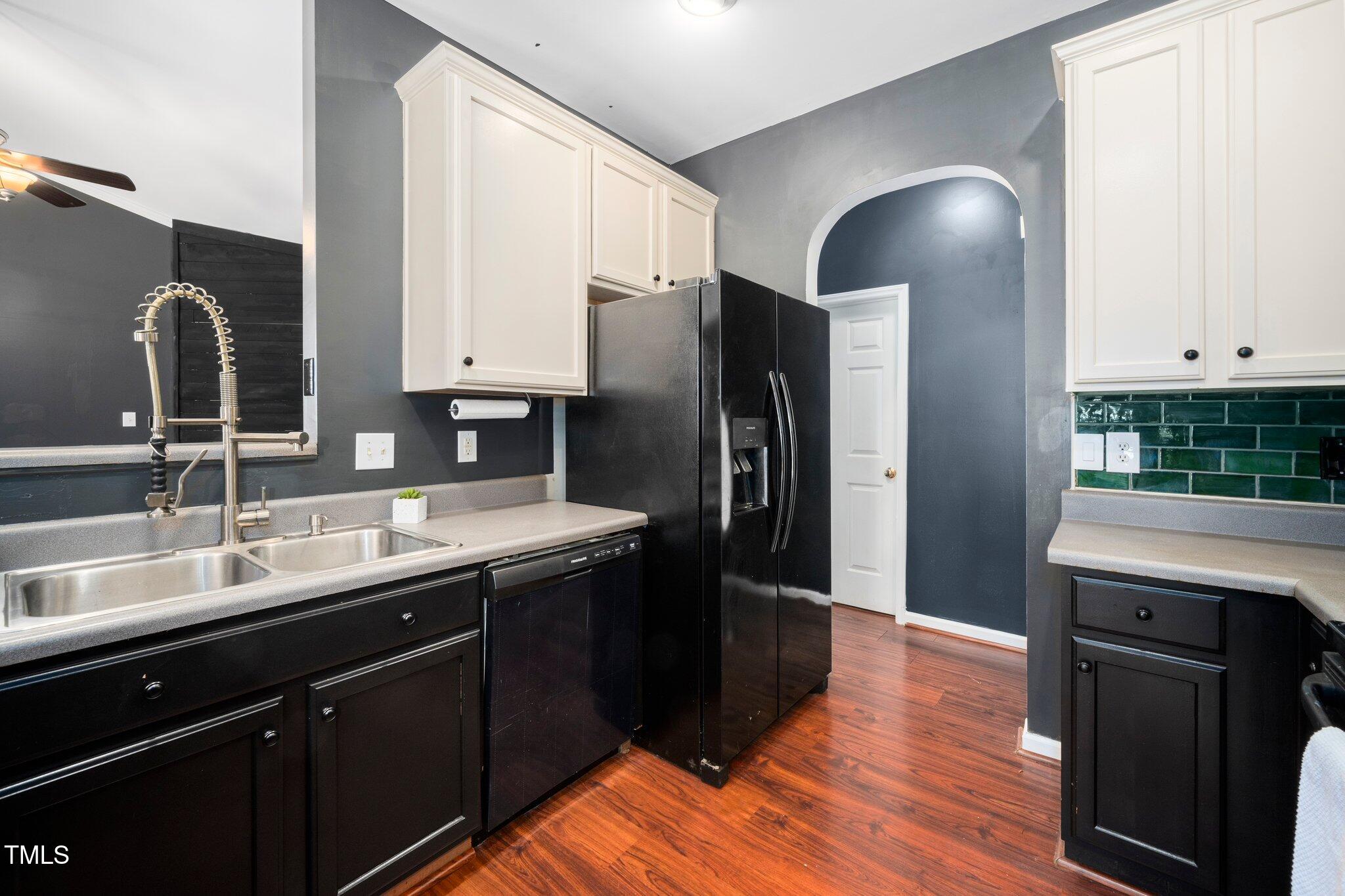 8300 Neuse Hunter Drive Raleigh, NC 27616 - Photo 12 of 32 a kitchen with stainless steel appliances granite countertop a sink a stove and refrigerator