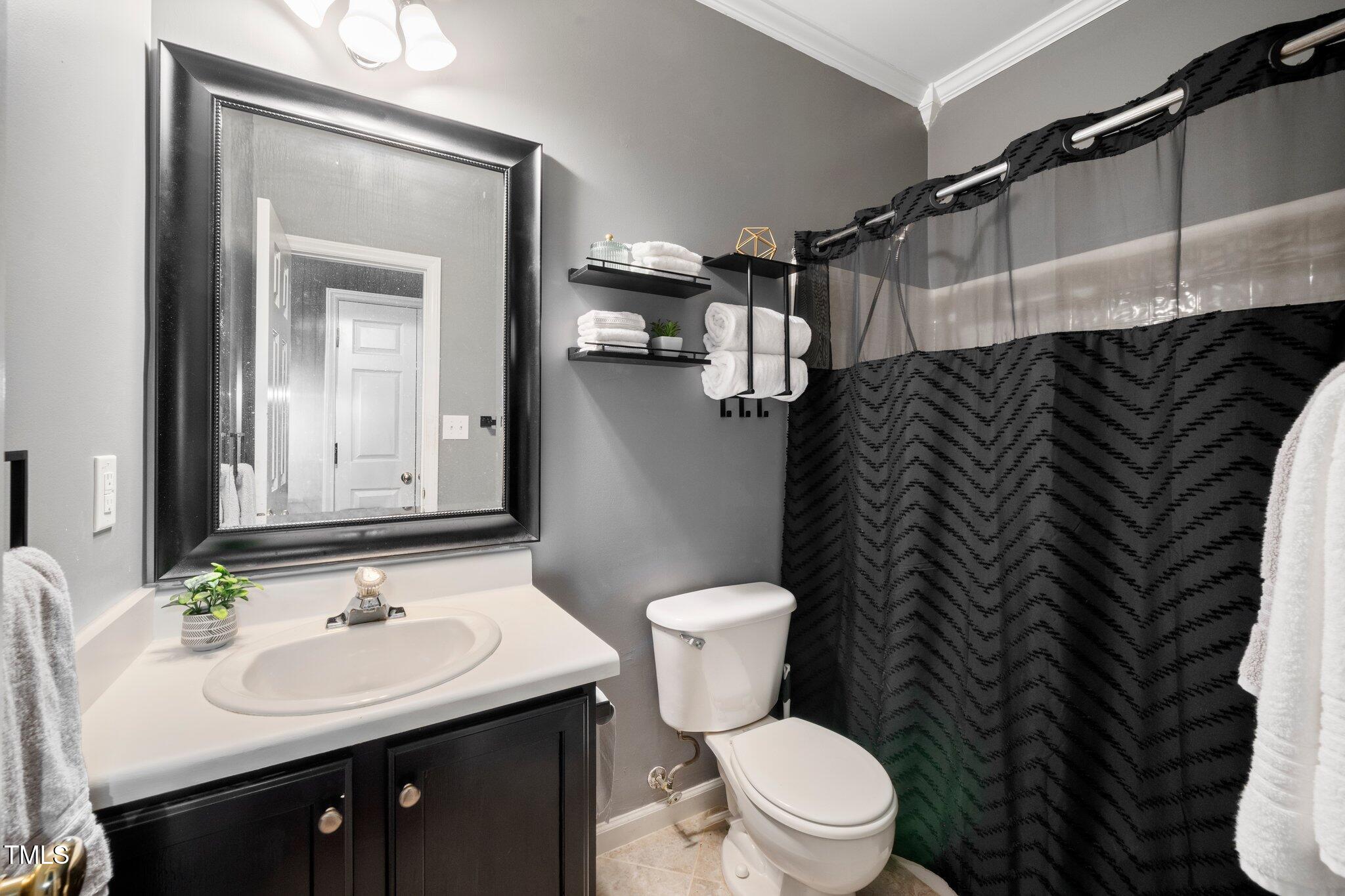 8300 Neuse Hunter Drive Raleigh, NC 27616 - Photo 20 of 32 a bathroom with a sink and a toilet
