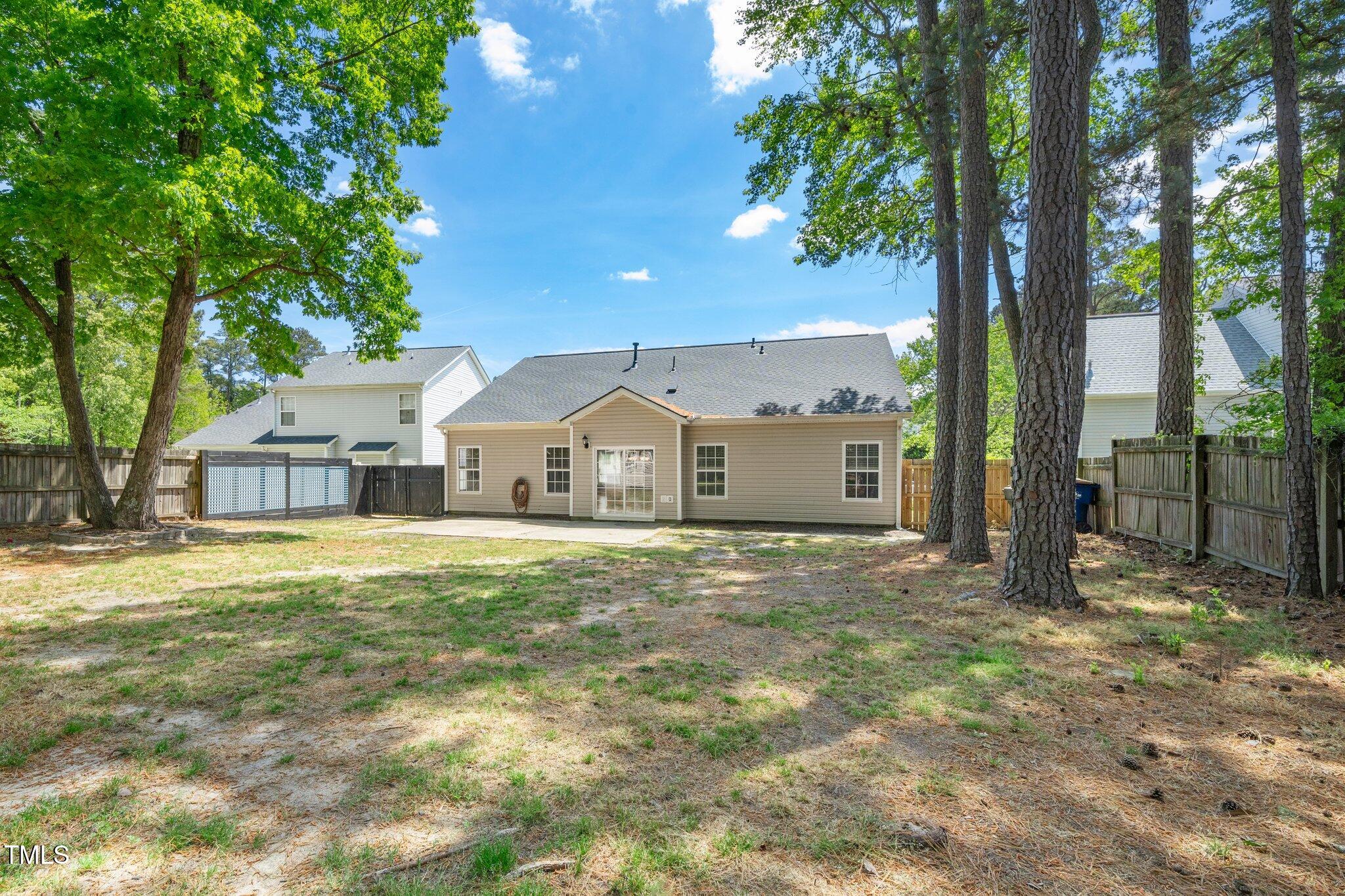 8300 Neuse Hunter Drive Raleigh, NC 27616 - Photo 26 of 32 a house with trees in front of it