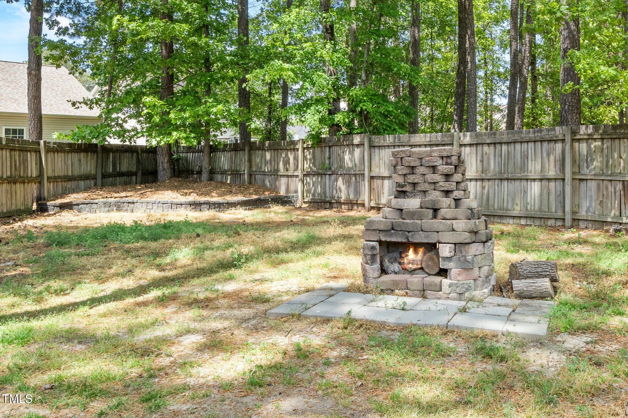 8300 Neuse Hunter Drive Raleigh, NC 27616 - Photo 28 of 32 a view of a house with backyard and sitting area