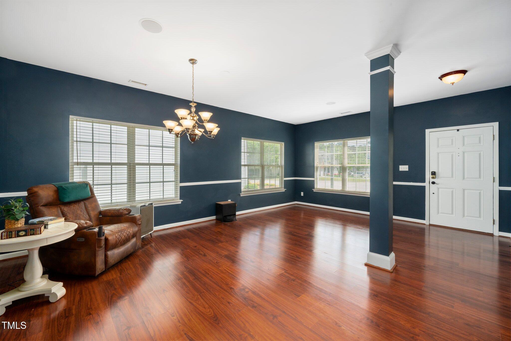 8300 Neuse Hunter Drive Raleigh, NC 27616 - Photo 3 of 32 a living room with furniture chandelier and a window